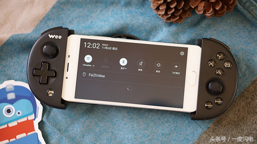 飞智wee手柄支持ios15.0,飞智游戏手柄wee拉伸手柄