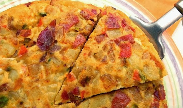 西班牙人爱吃啥,西班牙人吃生猪肉