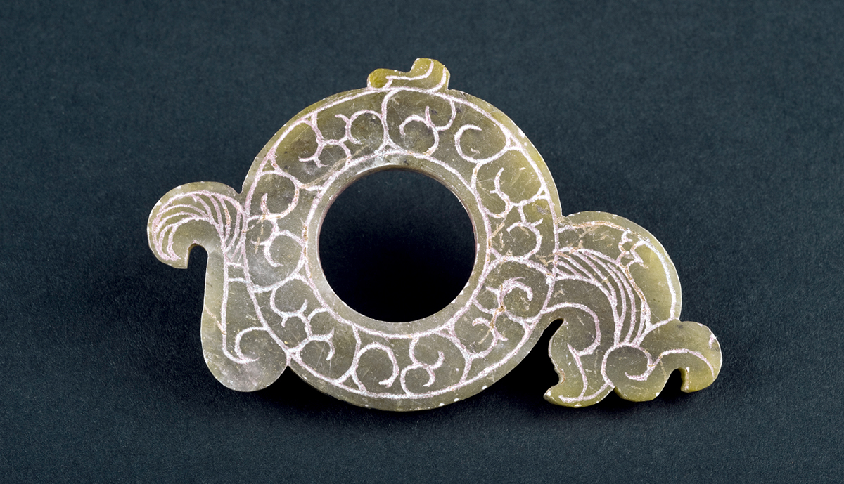 薛国故城出土*物文**——零圭断璧