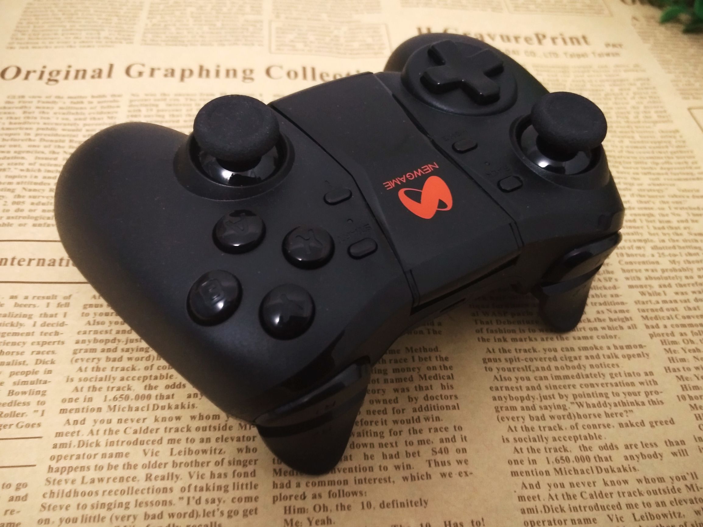 q1游戏手柄怎么样,新游智能游戏手柄q1pro