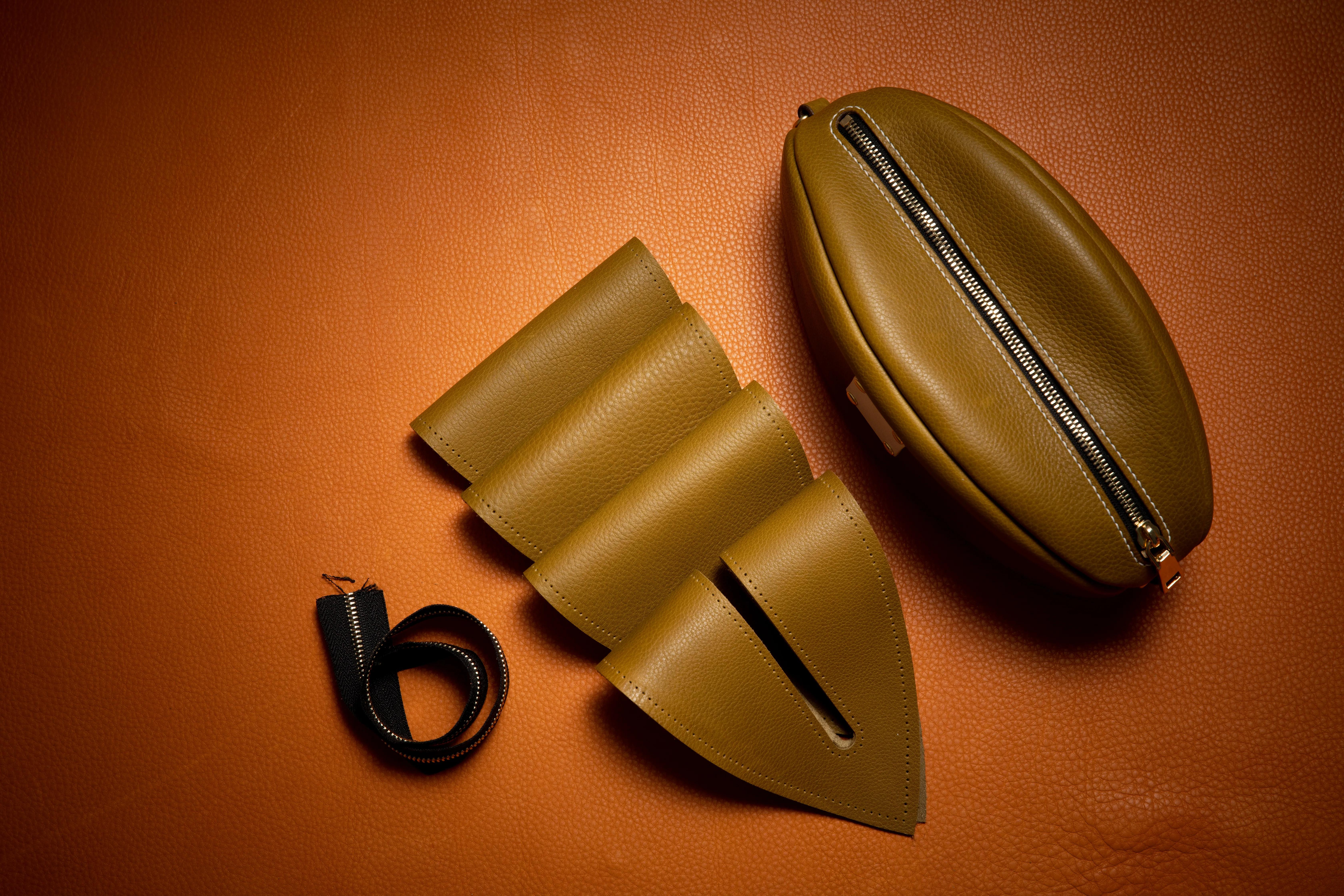 手工皮具橄榄球包制作,橄榄球型包包制作