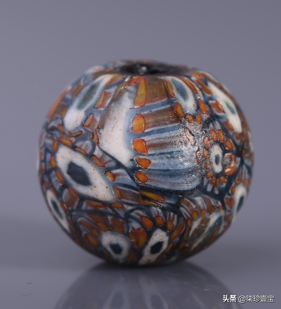 【古玩收藏与鉴赏】怎样辨别蜻蜓眼琉璃珠真伪。