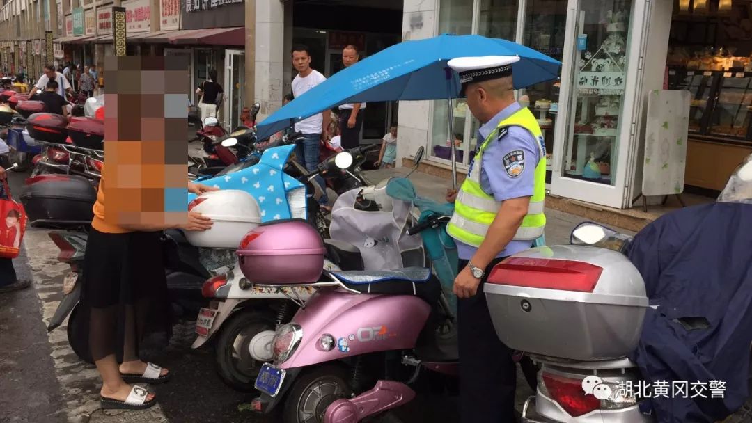 交警加装遮阳伞整治,交警电动车遮阳伞整治