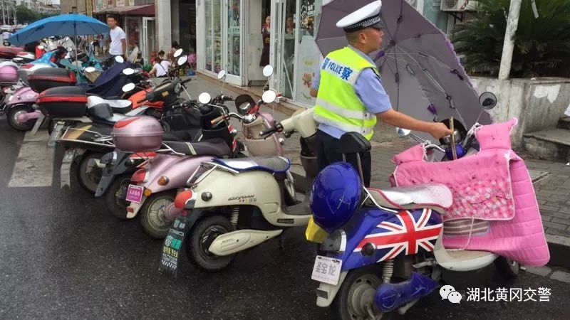 交警加装遮阳伞整治,交警电动车遮阳伞整治
