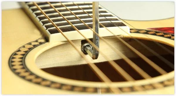 琴弦过高去琴行调节,琴弦过高怎么调