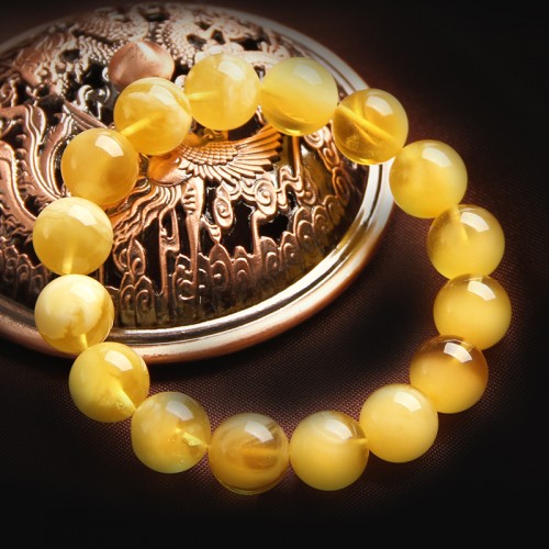 蜜蜡的功效与作用佩戴蜜蜡的好处,蜜蜡是鸡油黄的好还是白花蜜蜡好