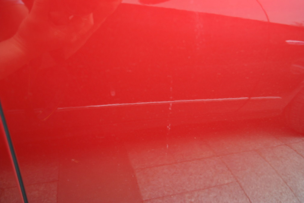 开门磕碰掉漆修补,车门被别人开门碰掉漆怎么索赔