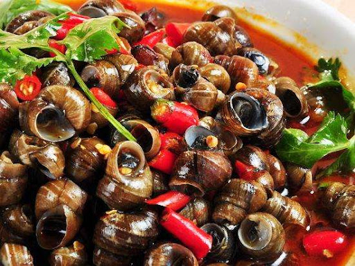 海螺尾部是黄还是屎可以吃吗,海螺尾部是肝脏还是屎