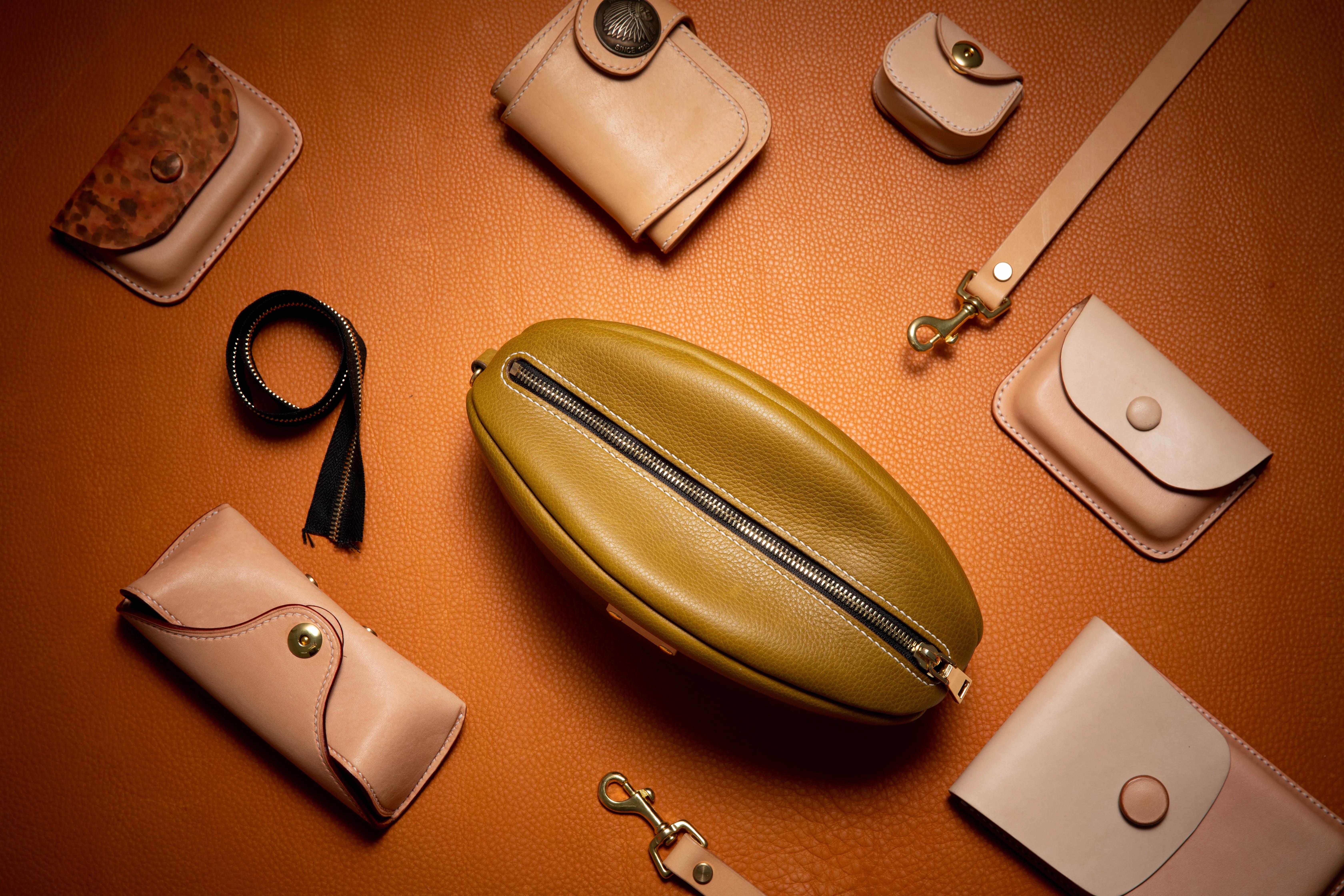 手工皮具橄榄球包制作,橄榄球型包包制作