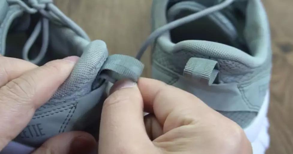 鞋子后面的拉环是干什么,鞋子后面的小拉环干什么的