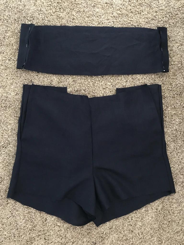 短裤一根布腰带的系法,短裤的一条裤带怎么系