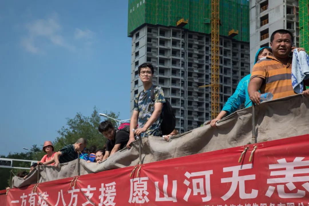 人在新乡，我们的家还在水里