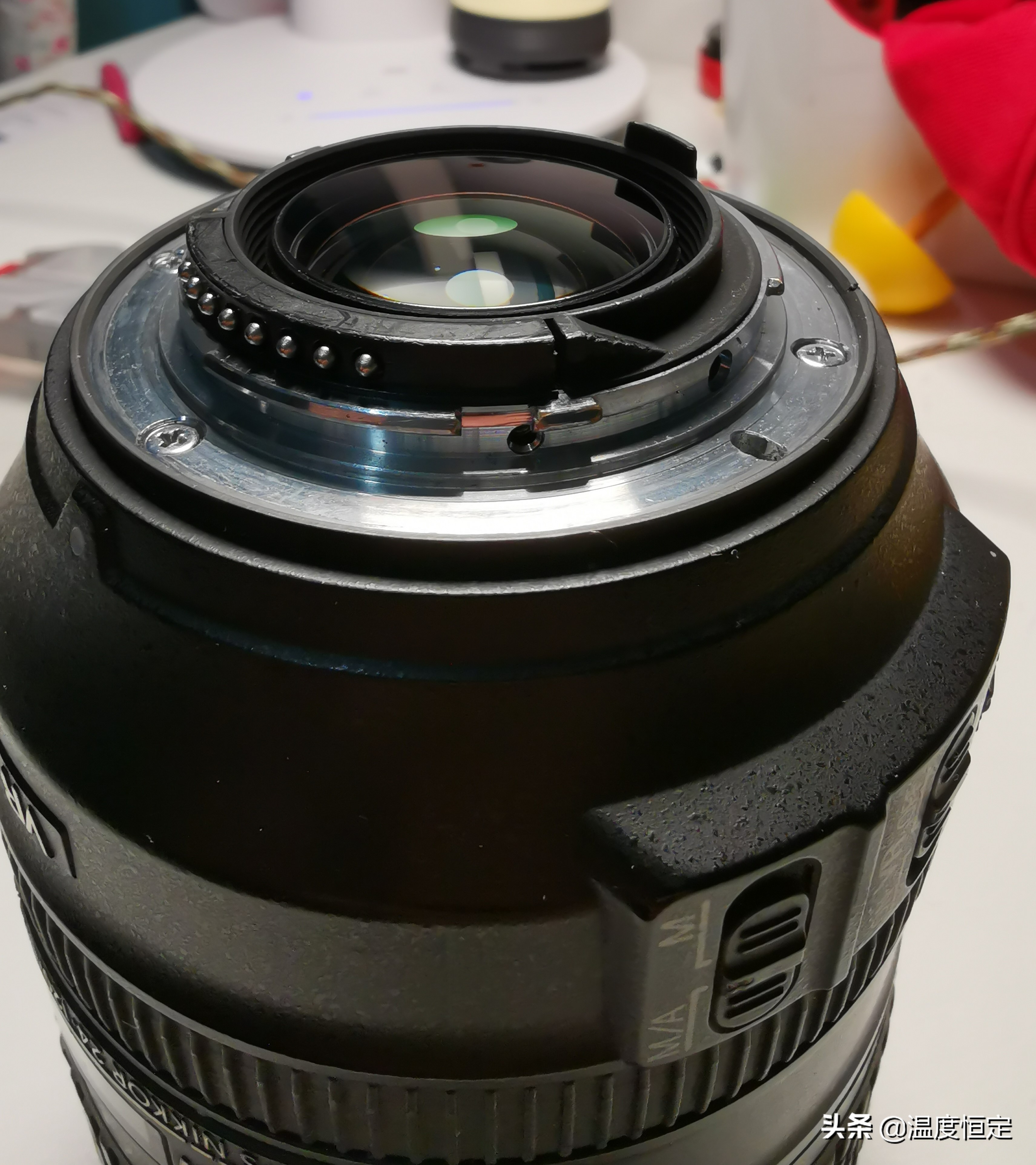 尼康镜头防抖打开一直响,尼康24-120镜头防抖怎么开