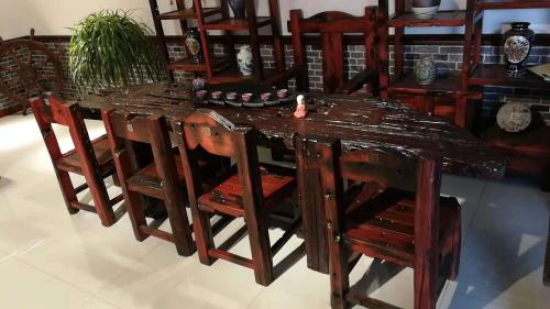 佛山木饰面板酒店装修效果图,木饰面板酒店民宿装修效果图