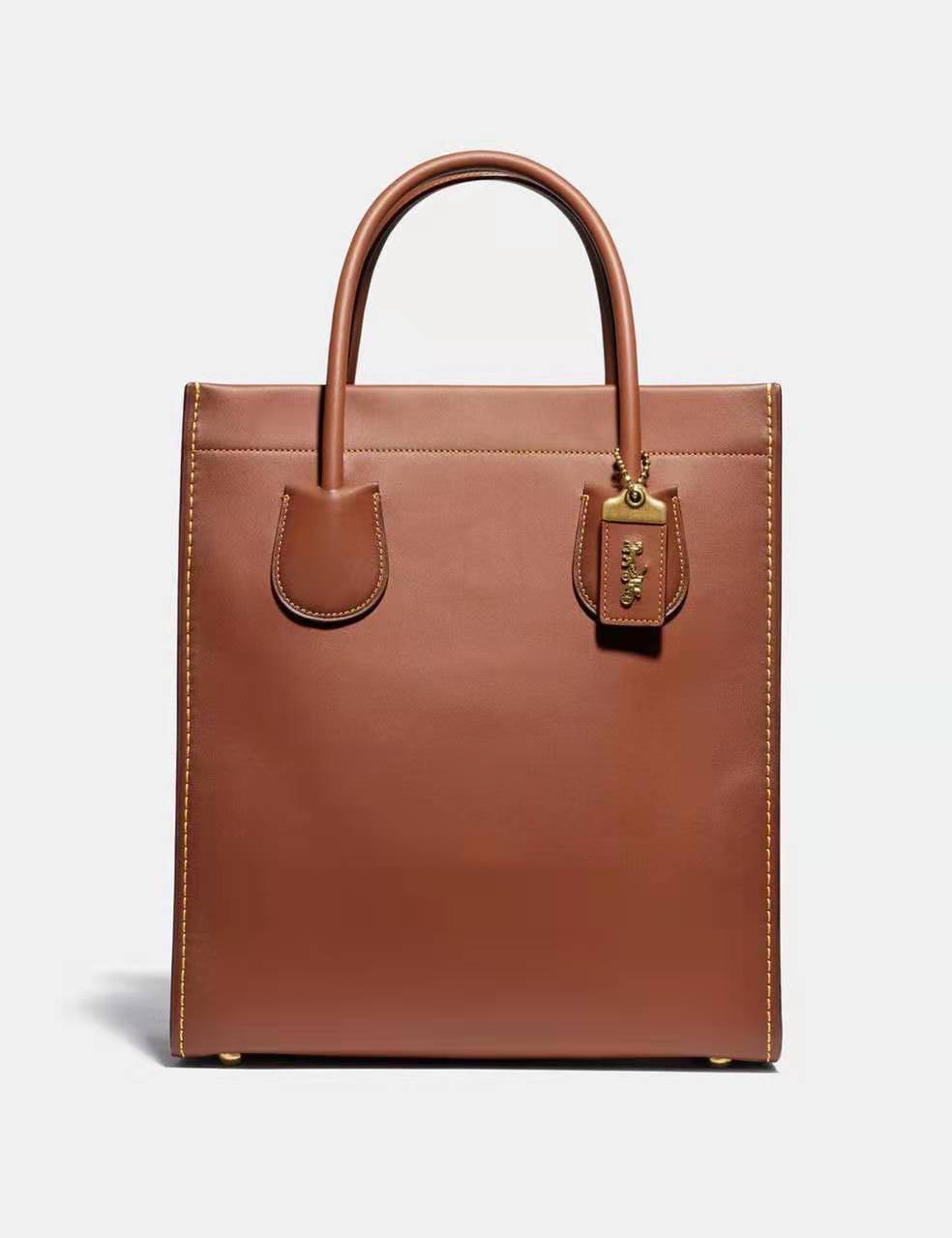 coach蔻驰与古驰是一个牌子吗,coach蔻驰经典款包包