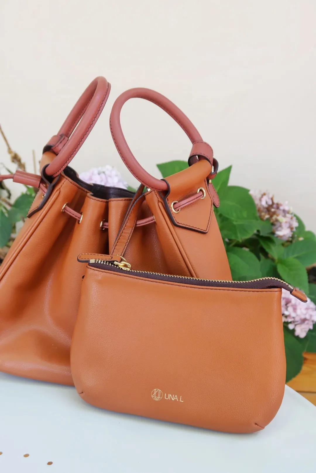 买了一大堆便宜包包,买了一个包回来发现包里有钱