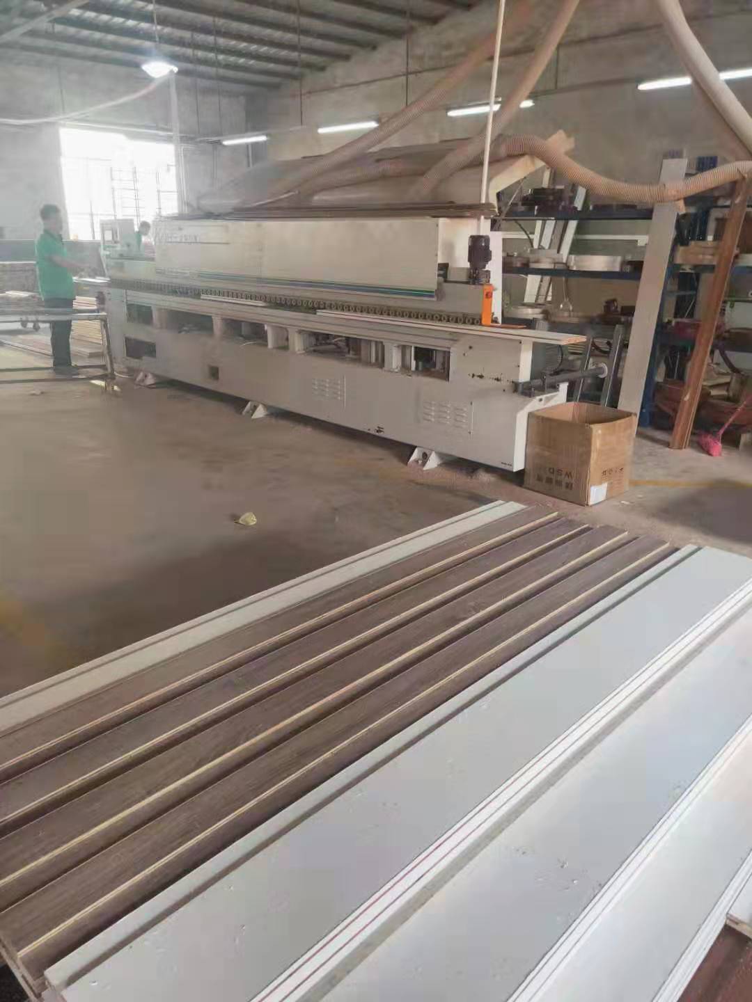 深入车间了解产品生产工艺,揭秘木门生产流程