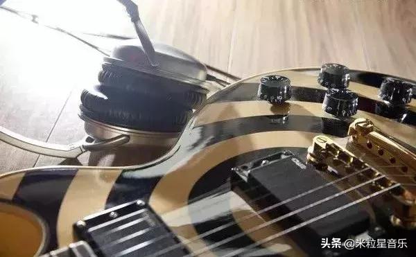 想学电吉他是不是要先学木吉他,想学电吉他必须先学会民谣吗