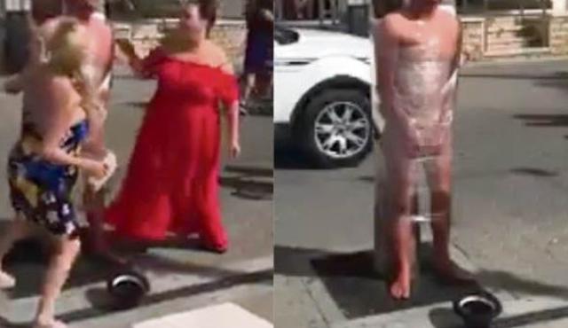 英国新郎被绑在大街示众事件,英国婚礼伴郎打新娘