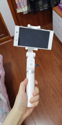 华为有线自拍杆的使用方法及操作,华为手机用自拍杆的使用方法图解