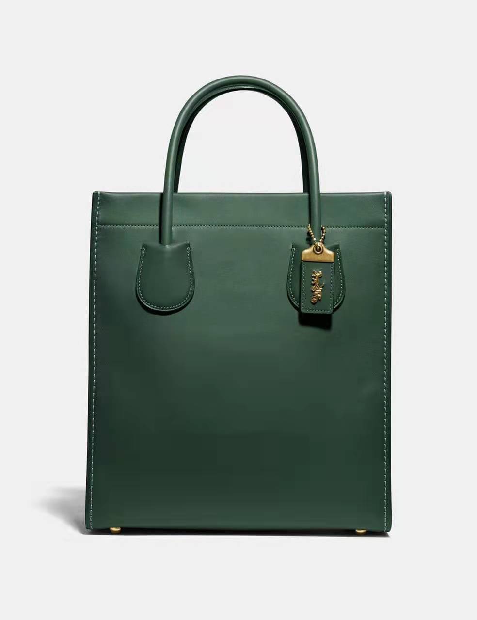 coach蔻驰与古驰是一个牌子吗,coach蔻驰经典款包包