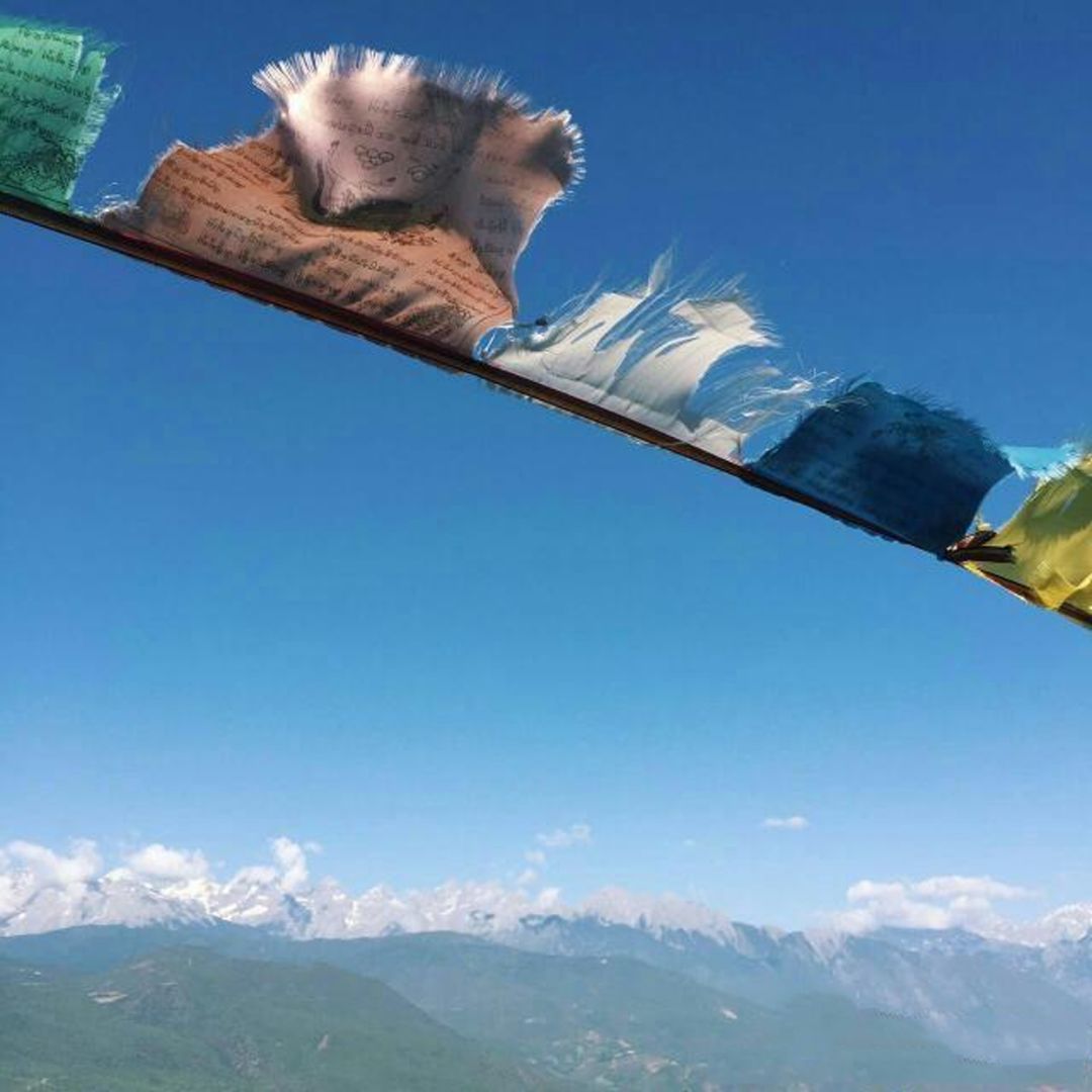 玉龙雪山日照金山的美,玉龙雪山日照金山美照