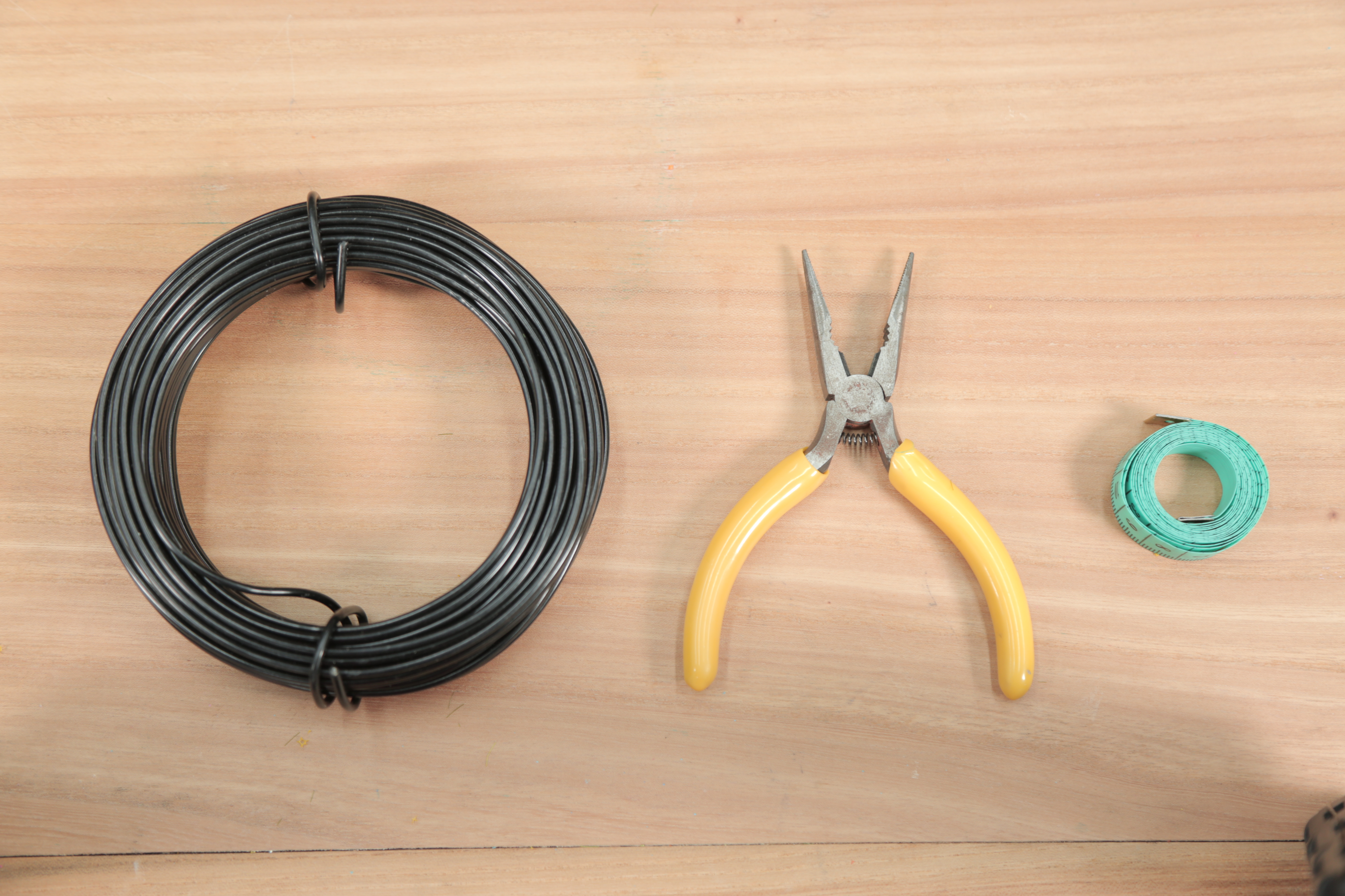 铁丝自制阳台花架,一根铁线自制花架