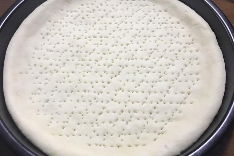 披萨皮松软还是脆的好吃,披萨皮为什么会不蓬松